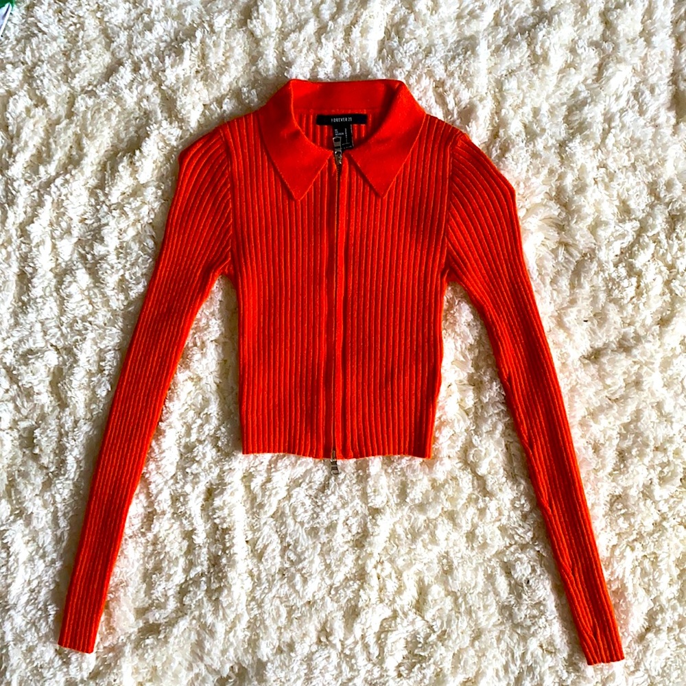Forever 21 slim-fitted top. Color is royal orange. Worn only once years ago.